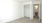 a room with a closet and a door to a bathroom
