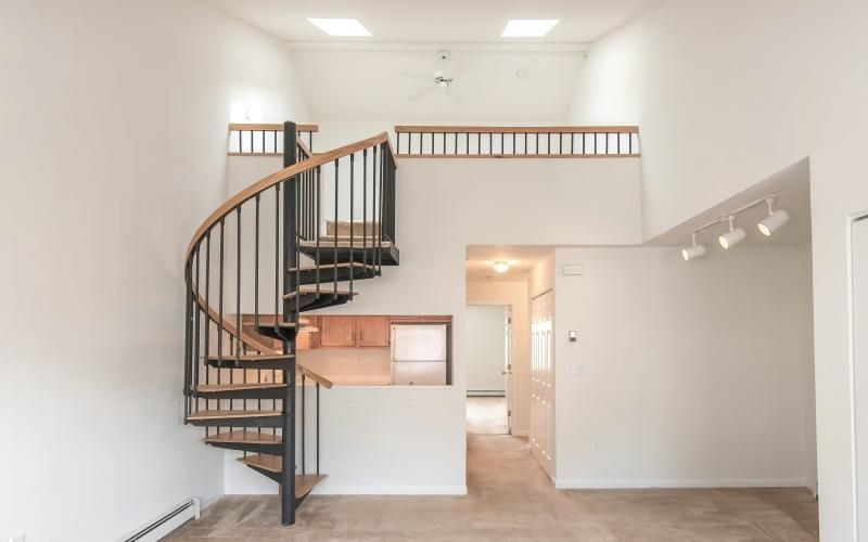 loft staircase in apartment with view into the hall