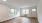 a living room with windows filling the room with natural light