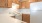 a kitchen with wooden cabinets